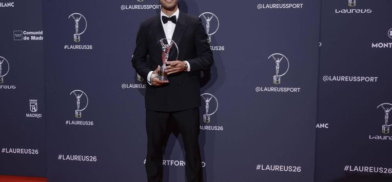 epa12903320 Spanish tennis player Carlos Alcaraz poses with the Sportsman of the Year award at the Laureus World Sports Awards Madrid 2026 in Madrid, Spain, 20 April 2026.  EPA/J.J. Guillen