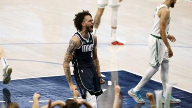 epa11411350 Dallas Mavericks center Dereck Lively II (L) reacts after dunking the ball for two points as Boston Celtics guard Derrick White (R) looks away during the second half of the NBA Finals game four between the Boston Celtics and the Dallas Mavericks in Arlington, Texas, USA, 14 June 2024.  EPA/ADAM DAVIS SHUTTERSTOCK OUT