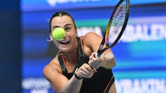 Belarus’ Aryna Sabalenka hits a return to Kazakhstan's Elena Rybakina during their women’s singles quarter-final match at the Wuhan Open tennis tournament in Wuhan, Central China’s Hubei province on October 10, 2025. 
ADEK BERRY / AFP