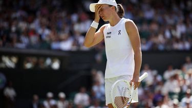 Poland's Iga Swiatek reacts as she plays against Philippines' Alexandra Eala during their women's singles third round tennis match on the sixth day of the 2026 Wimbledon Championships at The All England Lawn Tennis and Croquet Club in Wimbledon, southwest London, on July 4, 2026. 
Henry NICHOLLS / AFP