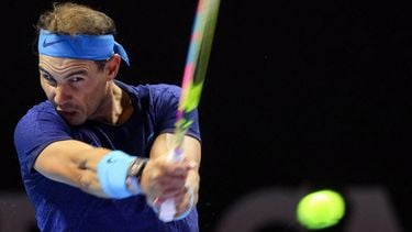 Spain's Rafael Nadal hits a return to Serbia's Novak Djokovic during their third-place tennis match in the 