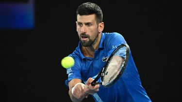 epa11835778 Novak Djokovic of Serbia plays a shot during the Men's Singles round four match against Jiri Lehecka of the Czech Republic at the Australian Open tennis tournament in Melbourne, Australia, 19 January 2025.  EPA/JAMES ROSS AUSTRALIA AND NEW ZEALAND OUT
