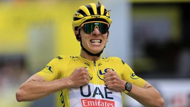epa11476119 Yellow jersey Slovenian rider Tadej Pogacar of UAE Team Emirates celebrates as he crosses the finish line to win the 14th stage of the 2024 Tour de France cycling race over 151km from Pau to Saint-Lary-Soulan Pla d'Adet, France, 13 July 2024.  EPA/GUILLAUME HORCAJUELO
