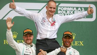 epa07716927 British Formula One driver Lewis Hamilton of Mercedes AMG GP (R) celebrates winning the Formula One Grand Prix of Great Britain with John Owen (head of design at Mercedes AMG) and Finnish Formula One driver Valtteri Bottas of Mercedes AMG GP (L) at the Silverstone circuit, in Northamptonshire, Britain, 14 July 2019.  EPA/GEOFF CADDICK