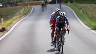 Team Soudal-Quick Step's French rider Julian Alaphilippe and Team Polti-Kometa's Italian rider Mirco Maestri ride ahead in Montecosaro during the 12th stage of the 107th Giro d'Italia cycling race, 193km between Martinsicuro and Fano, on May 16, 2024.  
Luca Bettini / AFP