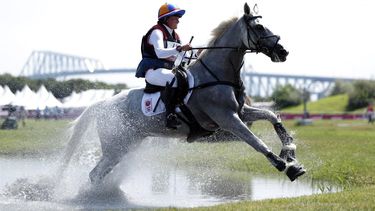 2021-08-01 10:02:24 epa09386389 Janneke Boonzaaijer of the Netherlands riding Champ De Tailleur competes in the Eventing Cross Country Team and Individual event of the Tokyo 2020 Olympic Games at the Sea Forest Cross Country Course in Tokyo, Japan, 01 August 2021.  EPA/KIYOSHI OTA