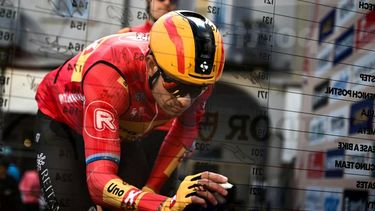 Uno-X Mobility Norwegian rider Alexander Kristoff signs next to his number prior to the start of the 115th Milan-SanRemo one-day classic cycling race, in Pavia, on March 16, 2024. 
Marco BERTORELLO / AFP