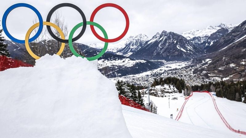 epa12708784 The Olympic rings are seen next to the Stelvio race track above the town of Bormio during the men's third official Alpine Skiing Downhill training at the 2026 Olympic Winter Games at the Stelvio Ski Center in Bormio, Italy, 06 February 2026.  EPA/MICHAEL BUHOLZER