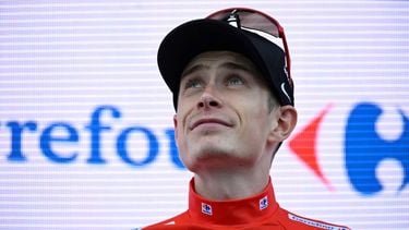 Overall race leader red jersey holder team Visma-Lease a bike's Danish rider Jonas Vingegaard celebrates on the podium of the 19th stage of the Vuelta a Espana, a 159 km race between Rueda and Guijuelo, on September 12, 2025.   
Miguel RIOPA / AFP