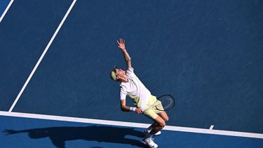 Italy's Jannik Sinner serves against Denmark's Holger Rune during their men's singles match on day nine of the Australian Open tennis tournament in Melbourne on January 20, 2025. 
WILLIAM WEST / AFP