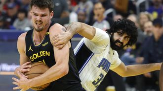 epa11873815 Golden State Warriors center Quinten Post (L) grabs a rebound away from Orlando Magic center Goga Bitadze (R) during the first half of the NBA game between the Orlando Magic and the Golden State Warriors in San Francisco, California, USA, 03 February 2025.  EPA/JOHN G. MABANGLO SHUTTERSTOCK OUT