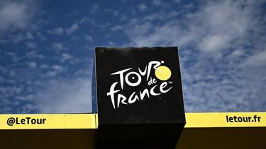 The Tour de France logo adorns the podium at the finish line of the 12th stage of the 111th edition of the Tour de France cycling race, 203,6 km between Aurillac and Villeneuve-sur-Lot, southwestern France, on July 11, 2024. 
Marco BERTORELLO / AFP