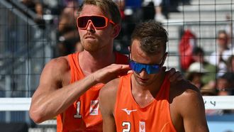 Netherlands' #01 Stefan Boermans and Netherlands' #02 Yorick De Groot react after loosing a point in the men's quarterfinal beach volleyball match between Germany and Netherlands during the Paris 2024 Olympic Games at the Eiffel Tower Stadium in Paris on August 6, 2024. 
CARL DE SOUZA / AFP