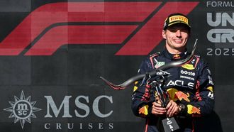 Race winner Red Bull Racing's Dutch driver Max Verstappen holds the trophy on the podium after the United States Formula One Grand Prix at the Circuit of the Americas in Austin, Texas, on October 19, 2025. 
RONALDO SCHEMIDT / AFP