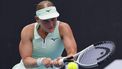 epa11825278 Suzan Lamens of Netherlands in action during the Women's round 2 match against Belinda Bencic of Switzerland at the Australian Open tennis tournament in Melbourne, Australia, 15 January 2025.  EPA/ROLEX DELA PENA