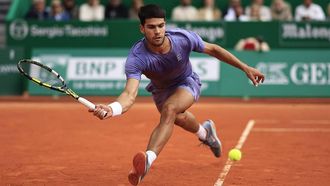Spain's Carlos Alcaraz plays a forehand return to Italy's Lorenzo Musetti during the Monte Carlo ATP Masters Series Tournament final tennis match at the Monte Carlo Country Club in Roquebrune-Cap-Martin on April 13, 2025. 
Valery HACHE / AFP