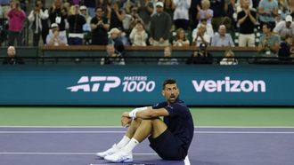 epa12813400 Novak Djokovic of Serbia falls to the ground after getting winded to win a point on a long rally during the men’s singles match against Jack Draper of Great Britain on day 8 of the BNP Paribas Open tennis tournament in Indian Wells, California, USA, 11 March 2026.  EPA/JOHN G. MABANGLO