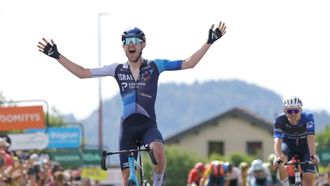 Team Israel Premier Tech's Canadian rider Derek Gee (L) celebrates as he crosses the finish line to win, ahead of Team Groupama-FDJ's French rider Romain Gregoire (R) the third stage of the 76th edition of the Criterium du Dauphine cycling race, 181,7km between Celles-sur-Durolle and Les Estables, central France, on June 4, 2024. 
Thomas SAMSON / AFP