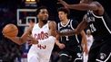 Cleveland Cavaliers' US Point Guard Donovan Mitchell (L) challenges Brooklyn Nets' US Small Forward Dorian Finney-Smith (R) during the NBA regular season basketball match between the Cleveland Cavaliers and the Brooklyn Nets at the Accor Arena in Paris on January 11, 2024. 
Emmanuel Dunand / AFP