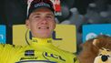 Team Soudal's Belgian rider Remco Evenepoel wearing the overall leader's yellow jersey celebrates on the podium after winning the fourth stage of the 76th edition of the Criterium du Dauphine cycling race, 34,4km individual time trial between Saint-Germain-Laval and Neulise, central France, on June 5, 2024. 
Thomas SAMSON / AFP