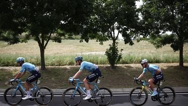 Astana Qazaqstan Team's British rider Mark Cavendish (R) cycles with teammates Astana Qazaqstan Team's Italian rider Michele Gazzoli (L) and Astana Qazaqstan Team's Dutch rider Cees Bol (C) to catch up to the pack of riders (peloton) during the 1st stage of the 111th edition of the Tour de France cycling race, 206 km between Florence and Rimini, in Italy, on June 29, 2024. 
Anne-Christine POUJOULAT / AFP