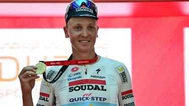 Team Soudal Quick-Step Belgian rider Tim Merlier celebrates on the podium after winning the fifth stage of the UAE Tour cycling race between the American University and the Hamdan bin Mohammed Smart University in Dubai on February 21, 2025. 
Giuseppe CACACE / AFP