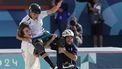 Australia's Keegan Palmer (C) is carried in triumph by US' Tate Carew (L) and Brazil's Pedro Barros after winning the gold medal at the end of the men's park skateboarding final during the Paris 2024 Olympic Games at La Concorde in Paris on August 7, 2024.  
Odd ANDERSEN / AFP