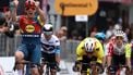 Lidl-Trek's Danish rider Mads Pedersen, next to Team Visma-Lease a Bike's Belgian rider Wout Van Aert (R), celebrates as he crosses the finish to win the first stage of the 108th Giro d'Italia cycling race, 160km from Durres to Tirana in Albania, on May 9, 2025.  
Luca Bettini / AFP