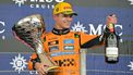 McLaren's British driver Lando Norris celebrates with the trophy and champagne after winning the Sao Paulo Formula One Grand Prix at the Jose Carlos Pace racetrack, aka Interlagos, in Sao Paulo, Brazil on November 9, 2025. 
Nelson ALMEIDA / AFP
