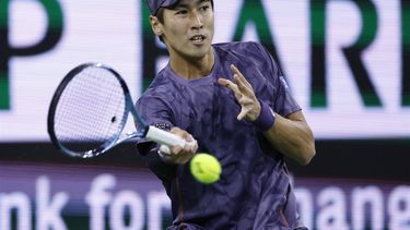 epa11953027 Yosuke Watanuki of Japan in action against Frances Tiafoe of the USA during the men’s  third round match of the BNP Paribas Open tennis tournament in Indian Wells, California, USA, 09 March 2025.  EPA/JOHN G. MABANGLO