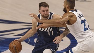 epa11372728 Dallas Mavericks guard Luka Doncic (L) dribbles past Minnesota Timberwolves center Rudy Gobert (R) during the first half of the NBA Western Conference Finals playoff game three between the Minnesota Timberwolves and the Dallas Mavericks in Dallas, Texas, USA, 26 May 2024.  EPA/ADAM DAVIS SHUTTERSTOCK OUT