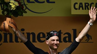 UAE Team Emirates - XRG team's Belgian rider Tim Wellens celebrates on the podium after winning the 15th stage of the 112th edition of the Tour de France cycling race, 169.3 km between Muret and Carcassonne, southwestern France, on July 20, 2025. 
Marco BERTORELLO / AFP