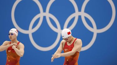 epa09381463 Qingfeng Wu of China (R) and Yufei Zhang of China (L) prepare for the Women's 50m Freestyle Semifinal during the Swimming events of the Tokyo 2020 Olympic Games at the Tokyo Aquatics Centre in Tokyo, Japan, 31 July 2021.  EPA/HOW HWEE YOUNG