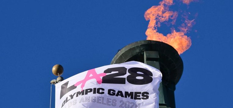 The LA28 Olympic cauldron is lit during a ceremonial lighting at the Memorial Coliseum in Los Angeles on January 13, 2026, ahead of the launch of ticket registration for the 2028 Summer Olympic Games. 
Frederic J. Brown / AFP