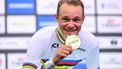 Gold medallist Italy’s Jonathan Milan celebrates on the podium after the Men's Individual Pursuit - Finals race of the UCI Track Cycling World Championships in Ballerup, Denmark, on October 18, 2024. 
Jonathan NACKSTRAND / AFP