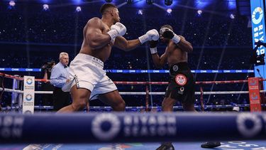 Britain's Anthony Joshua (L) throws a punch at Britain's Daniel Dubois during their heavyweight boxing match for the IBF world title at Wembley Stadium in London on September 21, 2024. 

Adrian Dennis / AFP