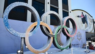 The Olympic Rings are displayed outside a sound stage during an NBC Universal Team USA filming event ahead of the 2026 Winter Olympics at the Sunset Glenoaks studios in Los Angeles, California on May 21, 2025. 
Patrick T. Fallon / AFP