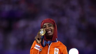 Gold medallist Netherlands' Sifan Hassan poses during the podium ceremony for the women's marathon of the athletics event during the closing ceremony of the Paris 2024 Olympic Games at the Stade de France, in Saint-Denis, in the outskirts of Paris, on August 11, 2024. 
Franck FIFE / AFP