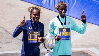 (L-R) Kenyan distance runners Sharon Lokedi and John Korir pose for pictures with the trophy after winning the women's and men's races, respectively, during the 129th Boston Marathon on April 21, 2025, in Boston, Massachusetts.  The marathon includes around 30,000 athletes from 129 countries running the 26.2 miles from Hopkinton to Boston, Massachusetts.  The event is the world's oldest annually run marathon. 
Joseph Prezioso / AFP