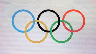 The photograph shows Olympic Rings during a ceremony to mark one year until the start of Milano Cortina Olympics in Strehler Theatre, in Milan, on February 6, 2025, ahead of the Milano Cortina 2026 Winter Olympic and Paralympic Games. 
MARCO BERTORELLO / AFP