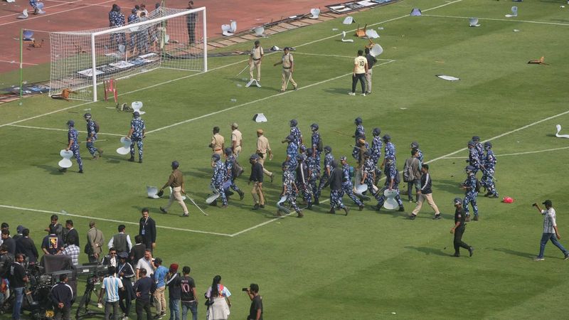 epa12588676 Riot control police are seen after angry Lionel Messi fans turned violent, throwing bottles and chairs and vandalising hoardings at Salt Lake Stadium in Kolkata, West Bengal, India, 13 December 2025. Following Messi’s brief five-minute appearance, unrest broke out among fans who had paid a significant amount but were unable to see the Argentine football legend.  EPA/PIYAL ADHIKARY