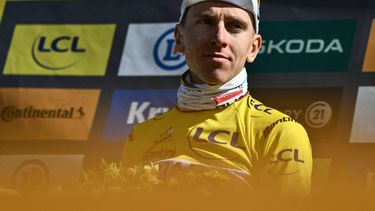 UAE Team Emirates - XRG team's Slovenian rider Tadej Pogacar celebrates on the podium with the overall leader's yellow jersey after the 16th stage of the 112th edition of the Tour de France cycling race, 171.5 km between Montpellier and Mont Ventoux, southern France, on July 22, 2025. 
Marco BERTORELLO / AFP