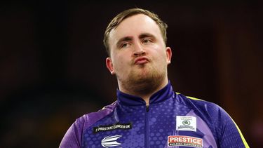 epa11055951 Britain’s Luke Littler pouts his lips during the PDC World Darts final against Britain’s Luke Humphries, in London, Britain, 03 January 2024.  EPA/ANDY RAIN