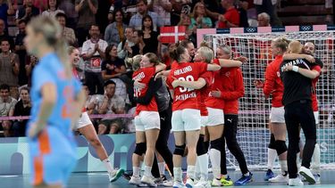 epa11529576 Players of Denmark celebrate after winning the quarter - final match against Netherlands during the Handball competitions in the Paris 2024 Olympic Games, at the South Paris Arena in Paris, France, 06 August, 2024.  EPA/ALEX PLAVEVSKI