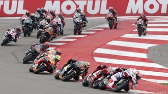 2023-09-24 18:24:13 epa10880546 Riders in action during the MotoGP race of the inaugural Motorcycling Grand Prix of India, in Dankaur, near Greater Noida, India, 24 September 2023.  EPA/RAJAT GUPTA