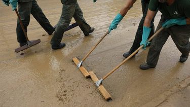 epa11694448 Officers of the INFOCA, a plan aimed to defend the Andalusian mountains against forest fires, clean a mud-covered street in Alora town, Malaga province, Andalusia region, Spain, 31 October 2024. There is no warning for rain or storms in the province of Malaga on 31 October, according to the State Meteorological Agency (AEMET), which reminded that the DANA (high-altitude isolated depression) phenomenon is still over Spain and that the meteorological emergency has not ended. More than 150 people died in the province of Valencia and neighboring provinces following floods caused by the DANA impacting the eastern part of the country.  EPA/JORGE ZAPATA