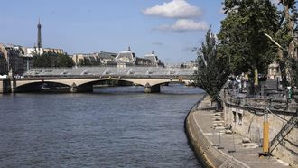 epa11483410 A view of Pont du Carrousel bridge with a seating installation for the Opening Ceremony of the Paris 2024 Olympic Games in Paris, France, 17 July 2024. From 18 to 26 July, the day of the Opening Ceremony of the Paris 2024 Olympic Games, security measures will be put in place in the French capital along the Seine river's banks and quays ahead of the main event. The Summer Olympics are scheduled to take place from 26 July to 11 August 2024 in Paris.  EPA/TERESA SUAREZ