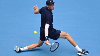 Italy's Jannik Sinner hits a return to USA's Learner Tien during their men's singles final match at the China Open tennis tournament in Beijing on October 1, 2025. 
WANG Zhao / AFP