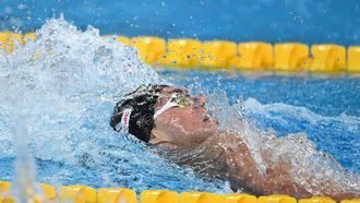 Netherlands' Kai Van Westering competes in a semi-final of the men's 200m backstroke swimming event during the 2024 World Aquatics Championships at Aspire Dome in Doha on February 15, 2024. 
SEBASTIEN BOZON / AFP