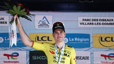 Stage winner Team Visma | Lease a Bike's Belgian rider Wout Van Aert celebrates on the podium of the 5th stage of the Tour Auvergne-Rhone-Alpes cycling race (formerly known as the Criterium du Dauphine), 195,8km between Saint-Chamond and Villars-les-Dombes, central France, on June 11, 2026. 
Anne-Christine POUJOULAT / AFP